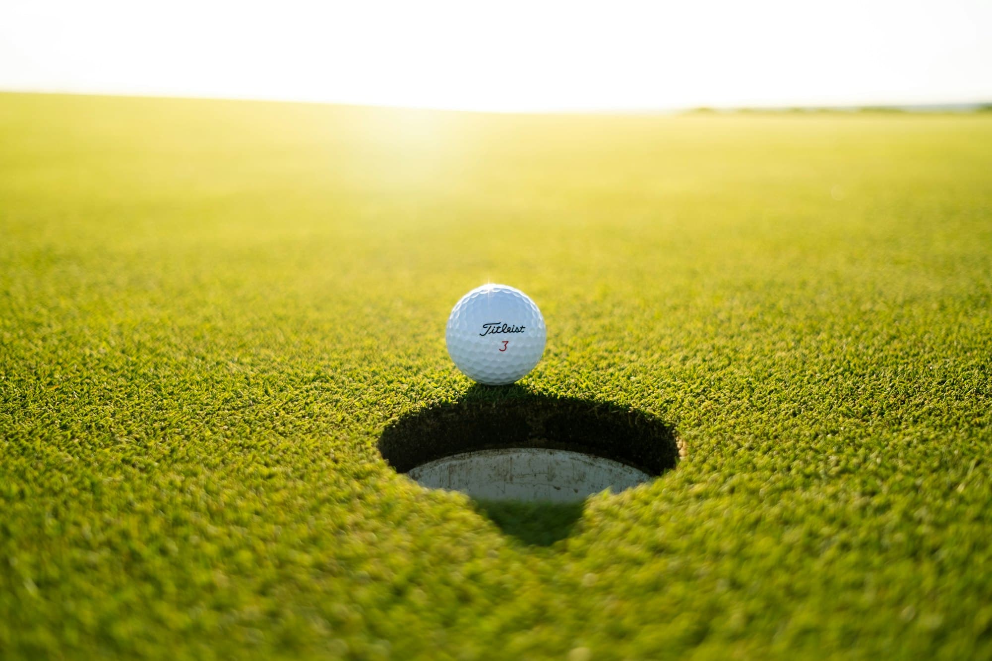 Sunlit championship fairway at dawn